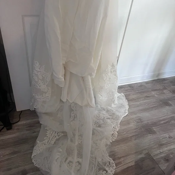 Brand new designer wedding dress, never altered, size 10